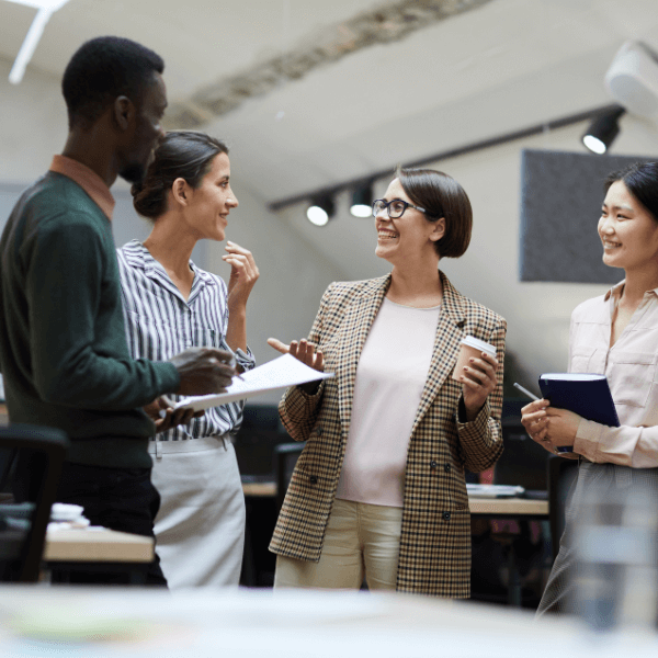 school marketing team gathers after team meeting